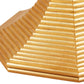 The Hourglass Table in Gold Patina by Bunny Williams features a golden, tiered, hexagonal pyramid design with ridged steps and a reflective finish, elegantly resting on an antique gold pedestal base.
