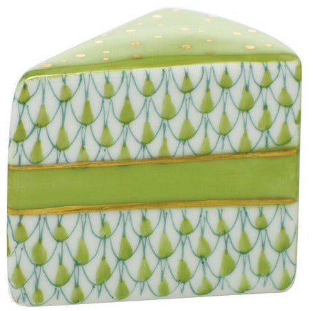The Herend "Slice of Cake" is a ceramic box designed to look like a cake slice, with hand-painted green and gold icing and geometric patterns—a delightful collectible for anyone who loves artistic decor.