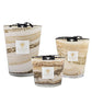 Three Baobab Sand Siloli Collection candles with swirled tan and white designs, displayed in varying sizes against a white background, featuring a subtle cedarwood tonka bean scent.