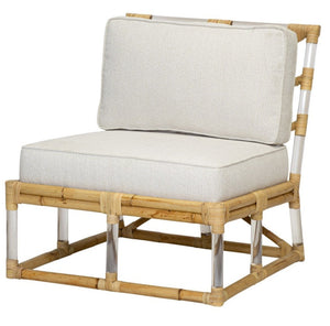 Introducing the Selamat Sea Cliff Slipper Chair: This stylish chair boasts a beige cushion and backrest, set within a hand-bent rectangular rattan frame for ultimate perfection. The design is enhanced with silver metallic accents on the legs and back support, drawing inspiration from Sea Cliff to effortlessly blend coastal elegance with modern flair.