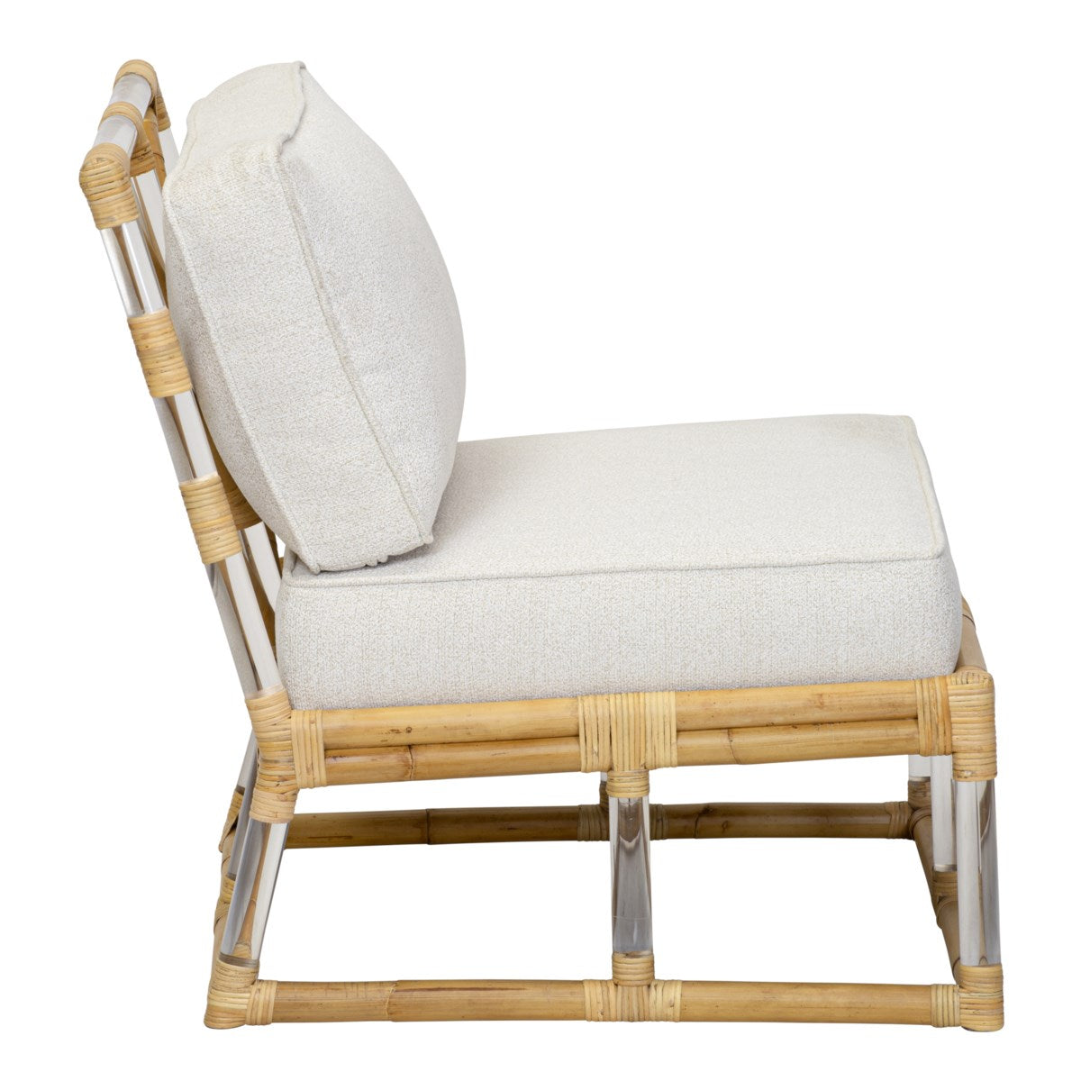 A side view of the Sea Cliff Slipper Chair by Selamat, featuring a cushioned chair with a bamboo frame and white seat and back cushions. The chair showcases a low profile, minimalist design with rattan hand-bent accents inspired by the Sea Cliff aesthetic.