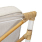 Close-up of the Selamat Sea Cliff Slipper Chair with hand-bent rattan details and clear acrylic supports. The upholstery features a light beige, textured Kravet Crypton Boucle fabric inspired by Sea Cliff.