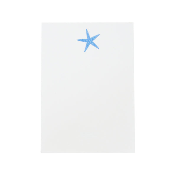 A blue Printery starfish on a bone white Printery pad.