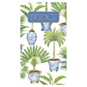 The Caspari Potted Palms Bridge Score Pad features an illustrated cover with blue and white vases and palm plants, plus a gold "BRIDGE" title—ideal for card games or as a stylish hostess gift.