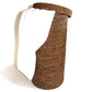 Tall Round Hamper with Cut Out Handle, Antique Brown by Matahari with a white towel hanging over the edge, featuring detailed product description, isolated on a white background.