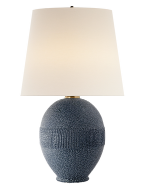 The Toulon Table Lamp from Visual Comfort features a beaded blue ceramic base paired with a white conical lampshade. It includes an E26 dimmer for personalized lighting and stands at a height of 27.25 inches, with an elegant round socket that brings modern sophistication to any room.