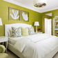 A bedroom with green walls, soft silver silk accents, and overall height created by the Visual Comfort Reflection Large Hanging Shade in Soft Silver.