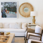 A living room with white furniture including a Mr Brown Belmont Coffee Table with hand-carved legs made of rustic pine.