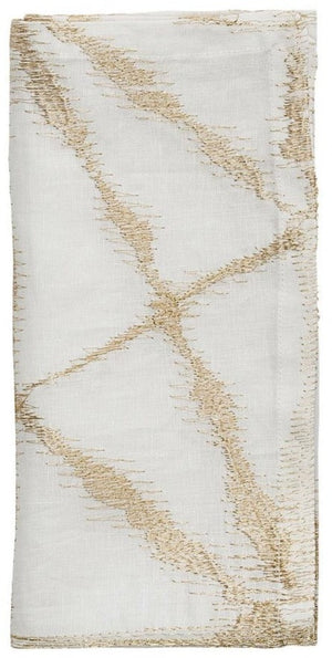 The Luna Napkin Set by Kim Seybert features folded white linen napkins with an abstract gold stitched pattern—ideal for weddings or chic bridal showers.