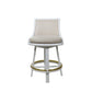 The White Rattan Swivel Bar Stool with Natural Linen by McGuire Furniture features a cushioned seat and backrest, four legs, and a circular gold footrest, making it an ideal choice for any modern kitchen or bar area.